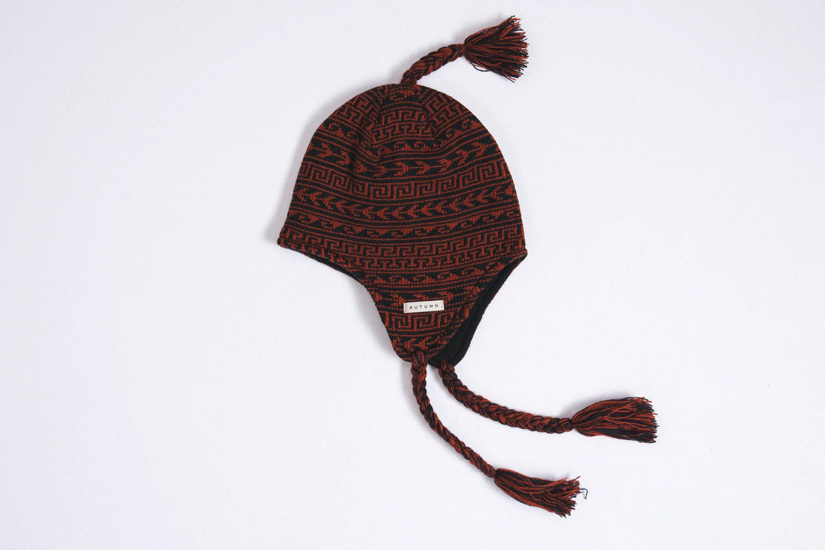 Autumn Swell Ear Flap Beanie in Harissa color showing cozy knit fabric and ear flaps, designed by Autumn Headwear for warmth and style.
