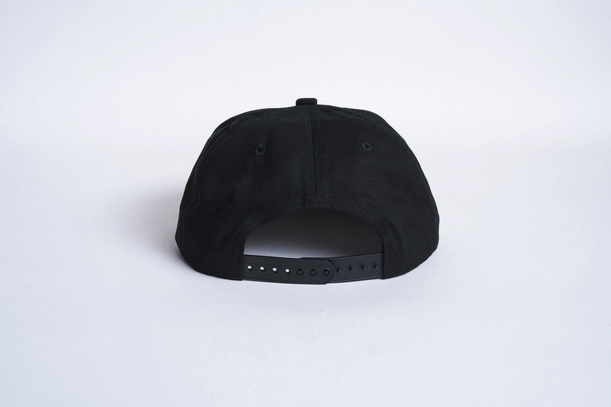 Black Autumn Twill Five Panel Snapback hat by Autumn Headwear, featuring a structured brim and adjustable strap.