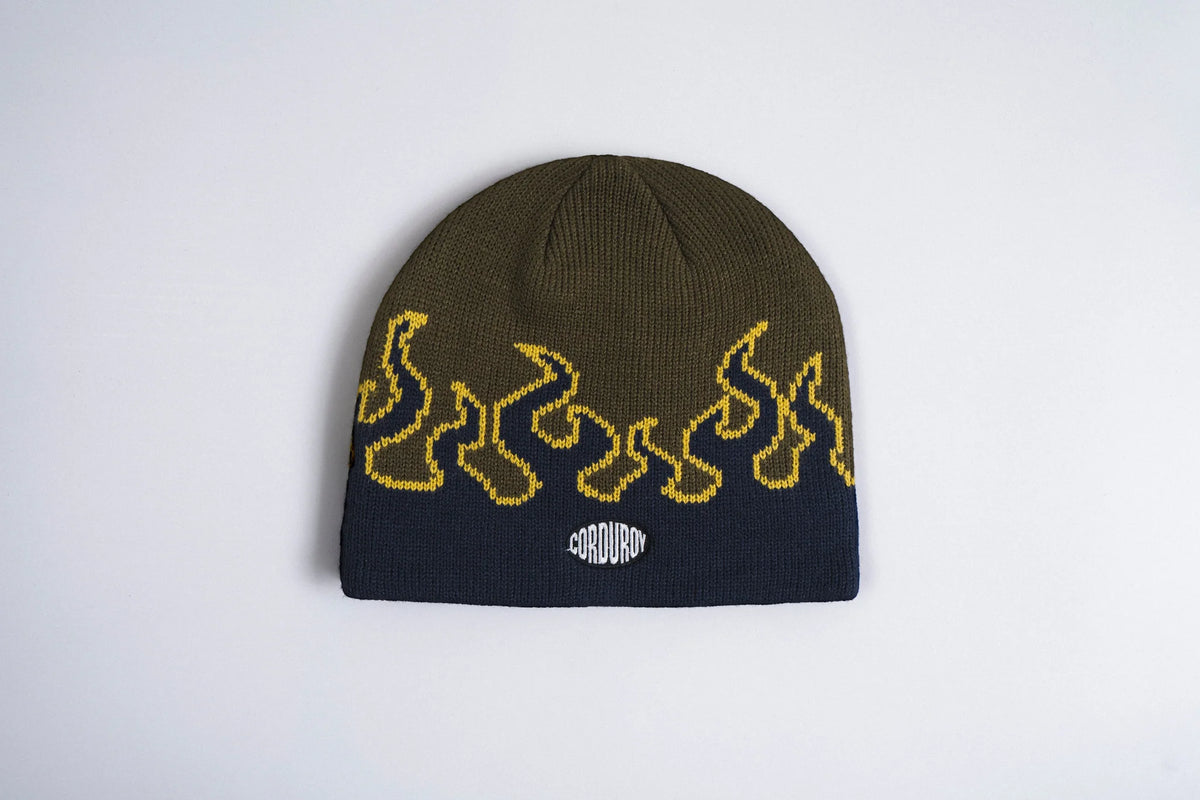 Corduroy LL Burn Skully Beanie in army green, made by Corduroy Headwear, showcasing its textured corduroy fabric and snug fit.