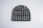 Black corduroy skully beanie with metal stud accents, stylish accessory by Corduroy Headwear, designed for a trendy, edgy look.