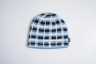Corduroy Tartan Justin Phipps beanie in sky blue with a soft, textured fabric and classic tartan pattern, designed for cozy style.