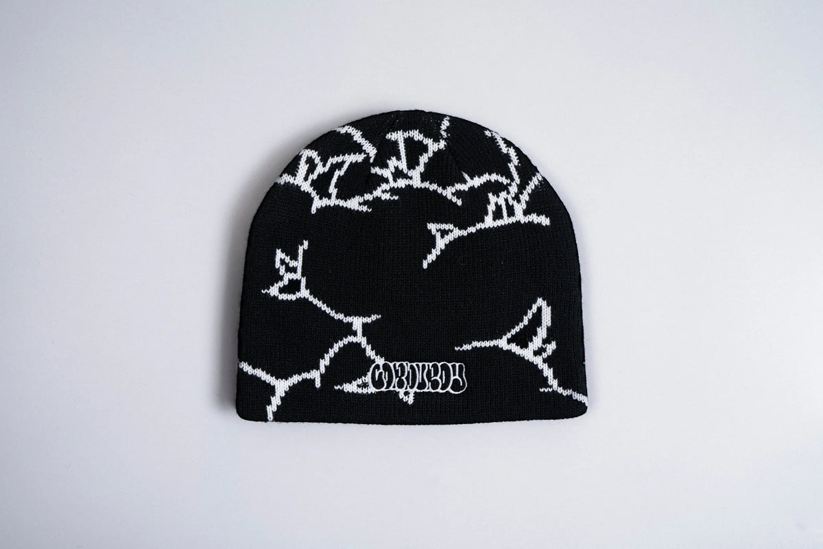 Black Corduroy The Nug beanie by Pat Fava, a stylish accessory with a textured corduroy fabric and snug fit.