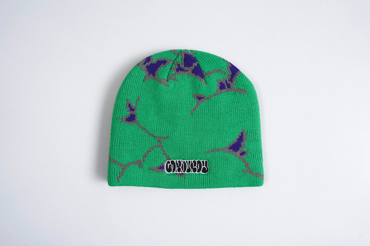 Green Corduroy The Nug beanie by Pat Fava, a stylish accessory with a textured corduroy fabric and snug fit.