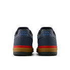 New Balance Numeric Jamie Foy 306C cupsole skate shoes in shadow blue and yellow, heel view