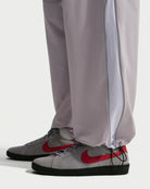 Nike SB Woven Skate Pants in Silver Lilac and Palest Purple, showing elastic cuff detail