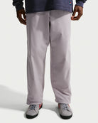 Nike SB men's woven skate pants in silver lilac and palest purple, front fit view
