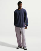 Nike SB men's woven skate pants in Silver Lilac and Palest Purple, front view on model