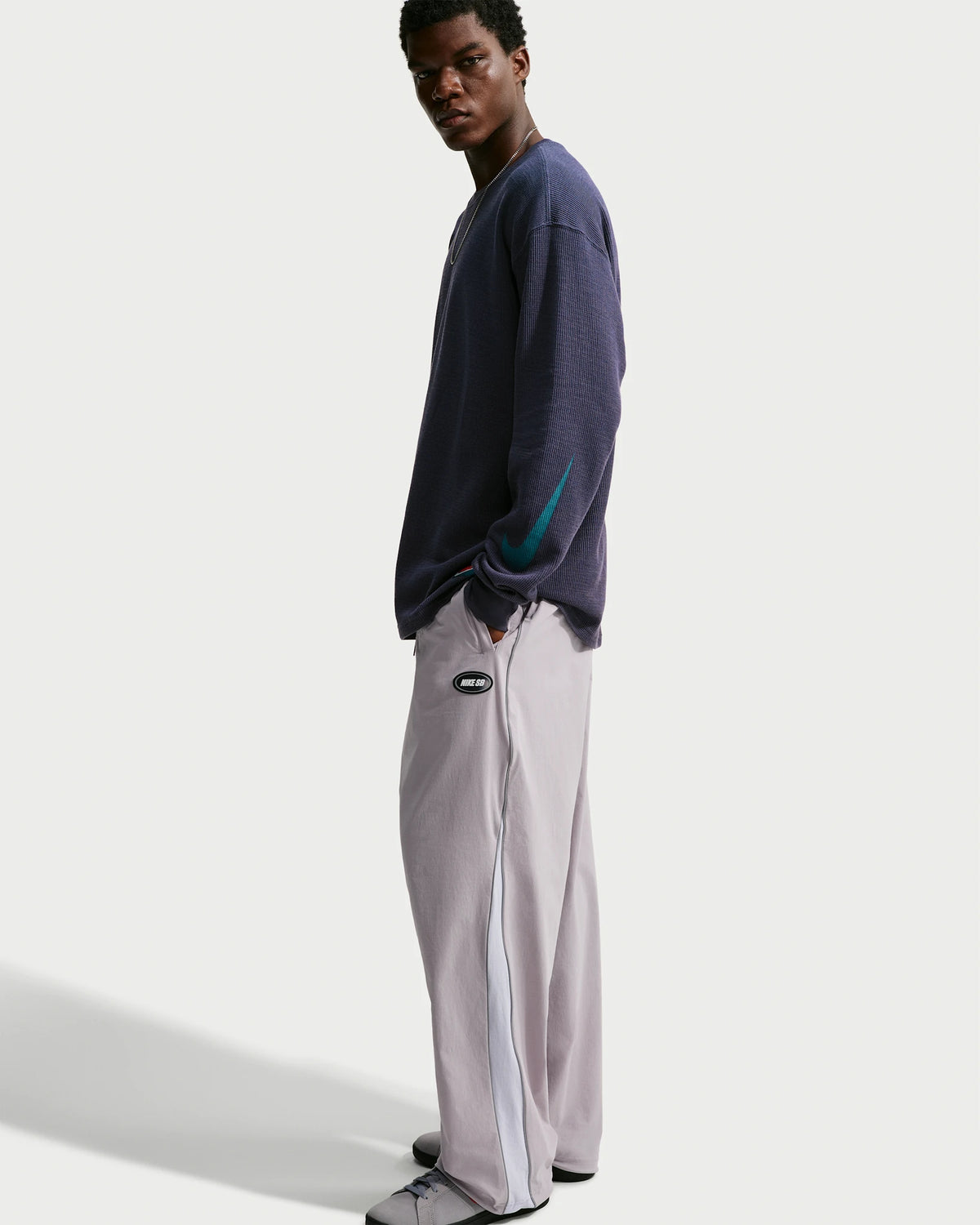 Nike SB men's woven skate pants in silver lilac and palest purple, side viewacles