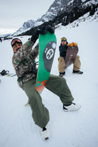 ThirtyTwo XXX Fava Pro snowboard lifestyle image in snow terrain