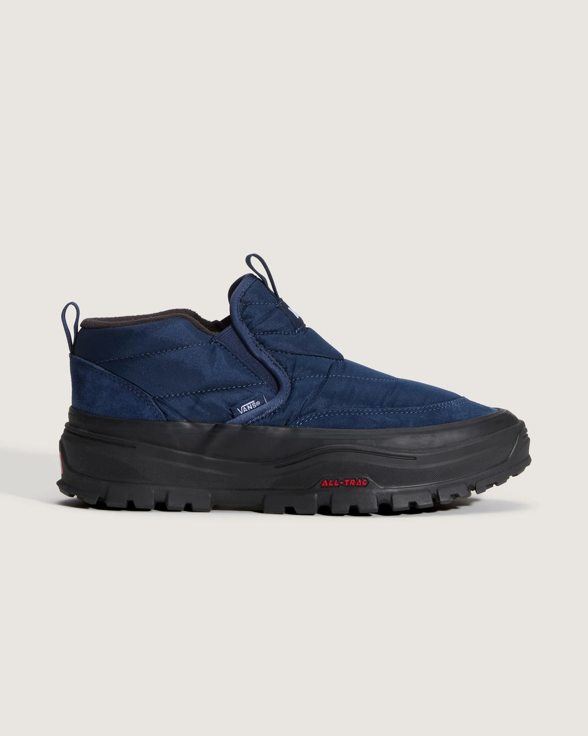 Vans Mid-Slip Puff shoes in true navy with padded slip-on design and textured upper